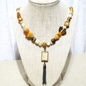 Silver and Gold Tone Necklace with a Bird, Butterfly and Beads.